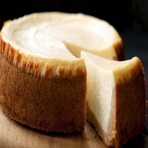 Classical,New,York,Cheesecake,With,Slice,Cut,Out.,Closeup,View
